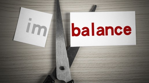 scissor cutting paper that says imbalance